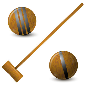 Wooden hammer and croquet balls