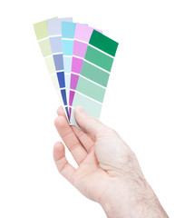 Fototapeta premium Man hand holding color samples isolated on white