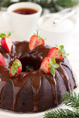 Fototapeta na wymiar Chocolate cake with strawberries and chocolate.