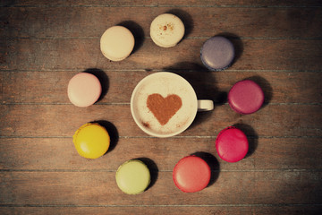 macrons with cup of coffee