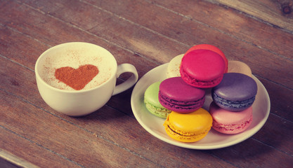 macrons with cup of coffee