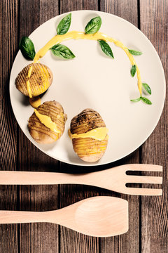 potatoes are served on dish with basil sauce and fennel