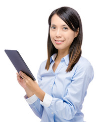 Asian woman holding digital tablet