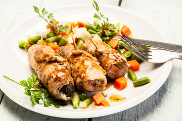 Beef rolls and vegetables