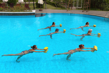 fitness people doing exercise in a swimming pool