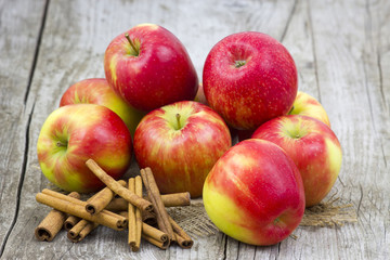 Red apples and cinnamon sticks