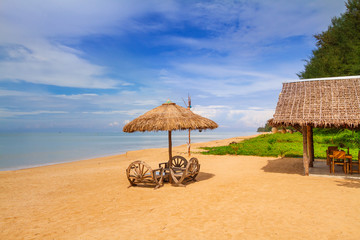 Tropical beach scenery with parasol in Thailand