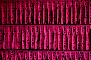 sheets of paper hanging in cultual pagoda