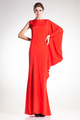 beautiful woman model posing in simple elegant red dress - 57162715