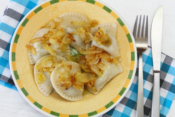 Polish dumplings garnished with fried onions