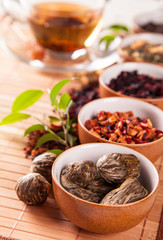 Various dry tea in small bowls