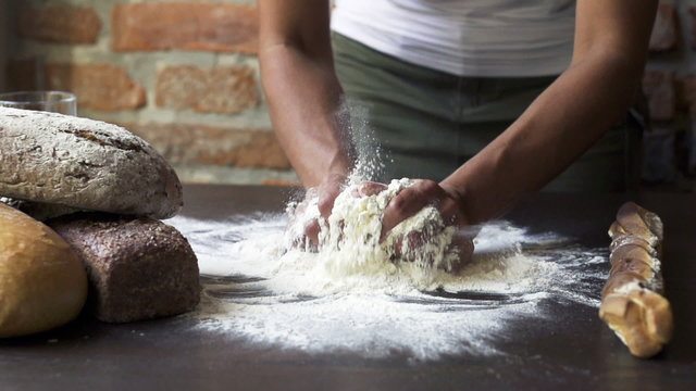 woman kneading the dough, slow motion at 240 fps
