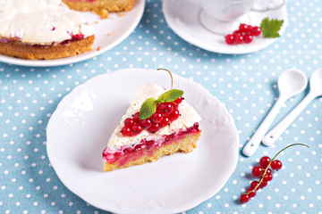 A piece of meringue red currant cake