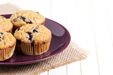 Healthy blueberry banana muffins on a plate