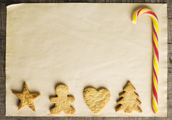 Christmas cookies and candy on a wooden background