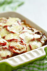 Casserole with meat, potato, tomato and cheese