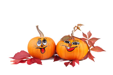 Halloween pumpkins with autumn leaves isolated on white