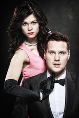 attractive retro couple sexy woman with gun and gangster