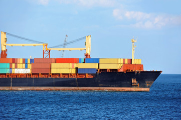 Fototapeta premium Container stack on freight ship in Black sea, Odessa, ukraine