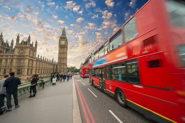 Fotobehang Iconic red bus passing over Westminster Bridge in London © jovannig