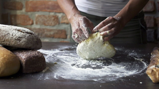 woman kneading the dough, slow motion at 240 fps