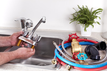 Obraz premium Plumber with a water tap.