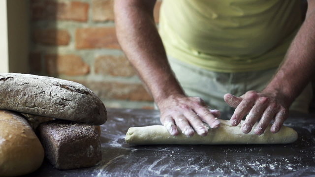 man rolling the dough, slow motion at 240 fps