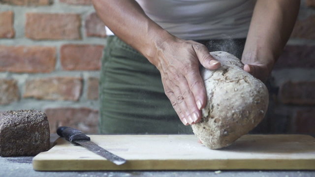 woman touching the loaf of bread, slow motion at 240fps