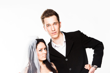 Beautiful and young married couple isolated on a white backgroun