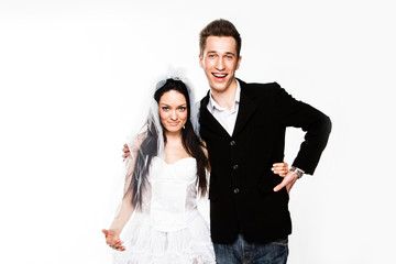 Beautiful and young married couple isolated on a white backgroun