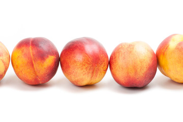 Ripe peaches fruits isolated on white