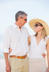 Middle Aged Couple Enjoying Walk on the Beach