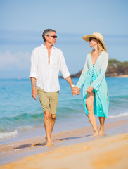 Middle Aged Couple Enjoying Walk on the Beach