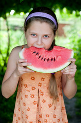 girl eating fresh watermelon