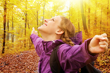 Happy young woman in autumn