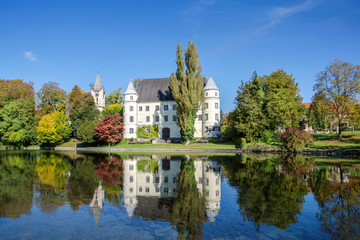 Fototapeta na wymiar Old castle with pond in Upper Austria