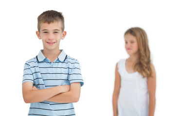 Child posing while his sister looking at him