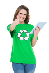 Happy environmental activist giving thumbs up holding tablet