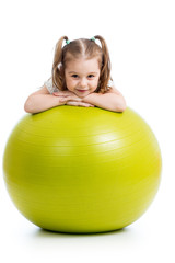 Kid girl having fun with  gymnastic ball isolated