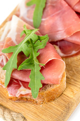 bread with sliced prosciutto crudo