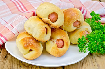 Sausage rolls on a plate with parsley