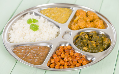 Thali - Vegetarian curries and rice in a traditional dish