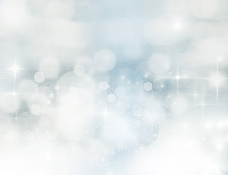 Light abstract Christmas background with white snowflakes