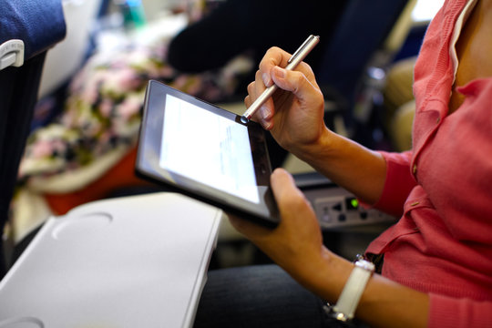 Hands with tablet computer.