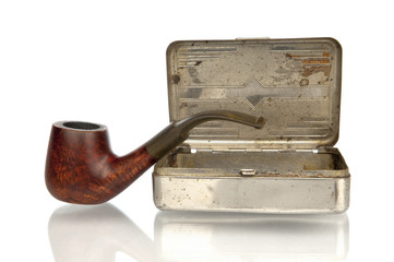 Pipe with tobacco box isolated in white