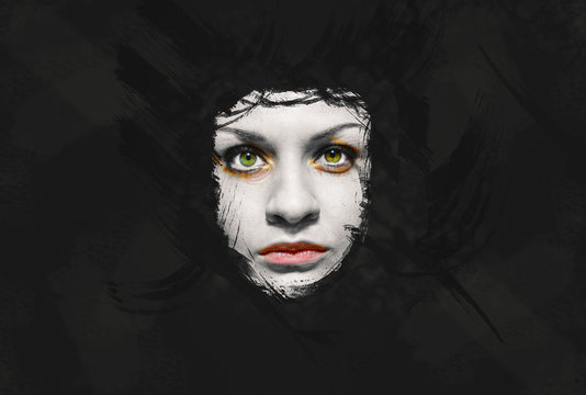 Creepy girl face on dark grunge background