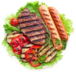 Grilled steak,sausages and vegetables.
