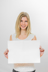 Naklejka premium Girl with big the sheet of pape