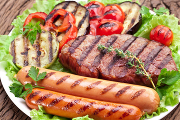 Grilled steak,sausages and vegetables.