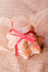 cinnamon christmas star cookies with red ribbon